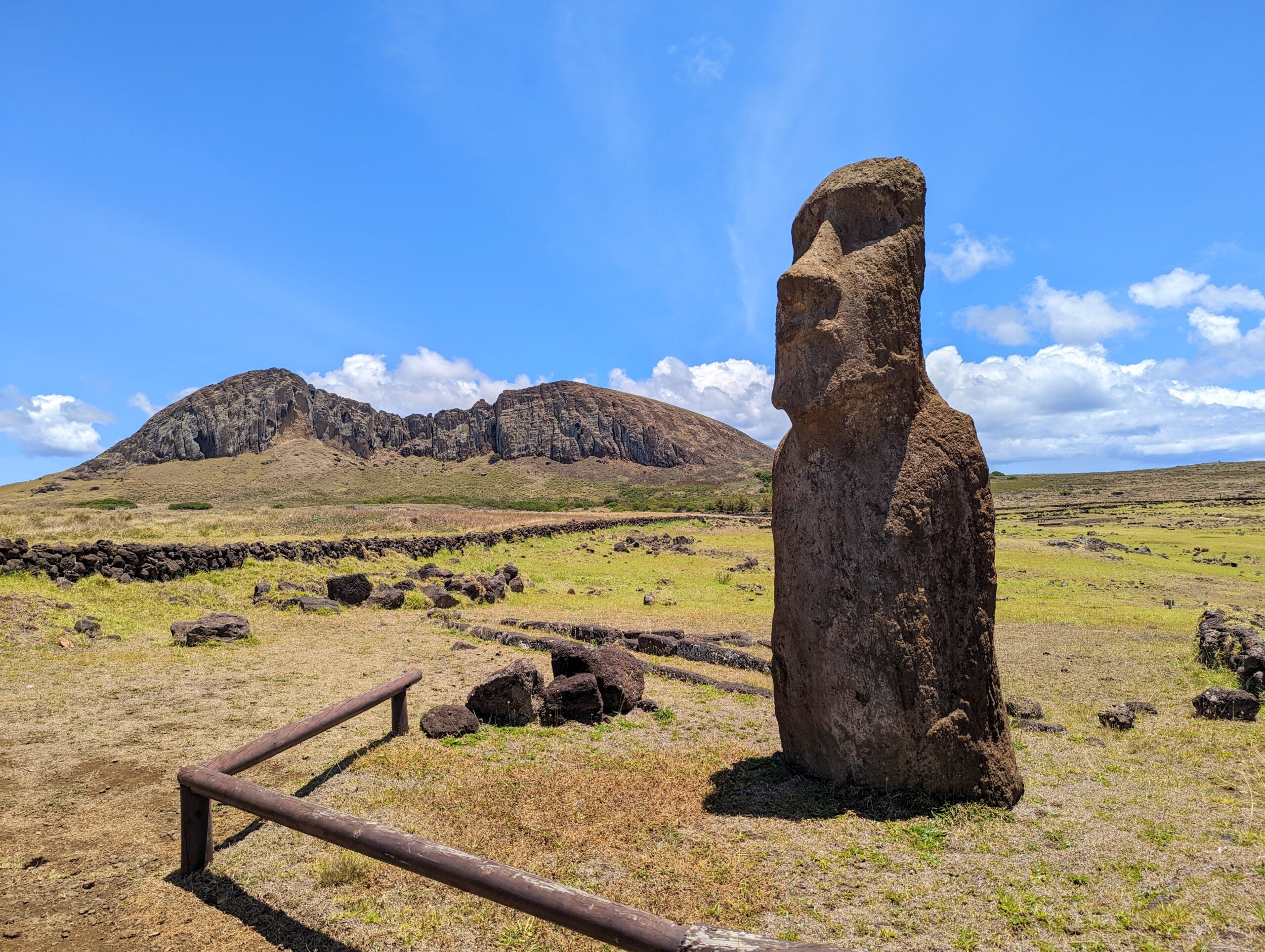 A shot of one Moai statue with the quarry behind it on Easter Island.