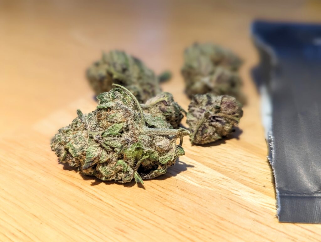 An image of medical cannabis on a wooden table.