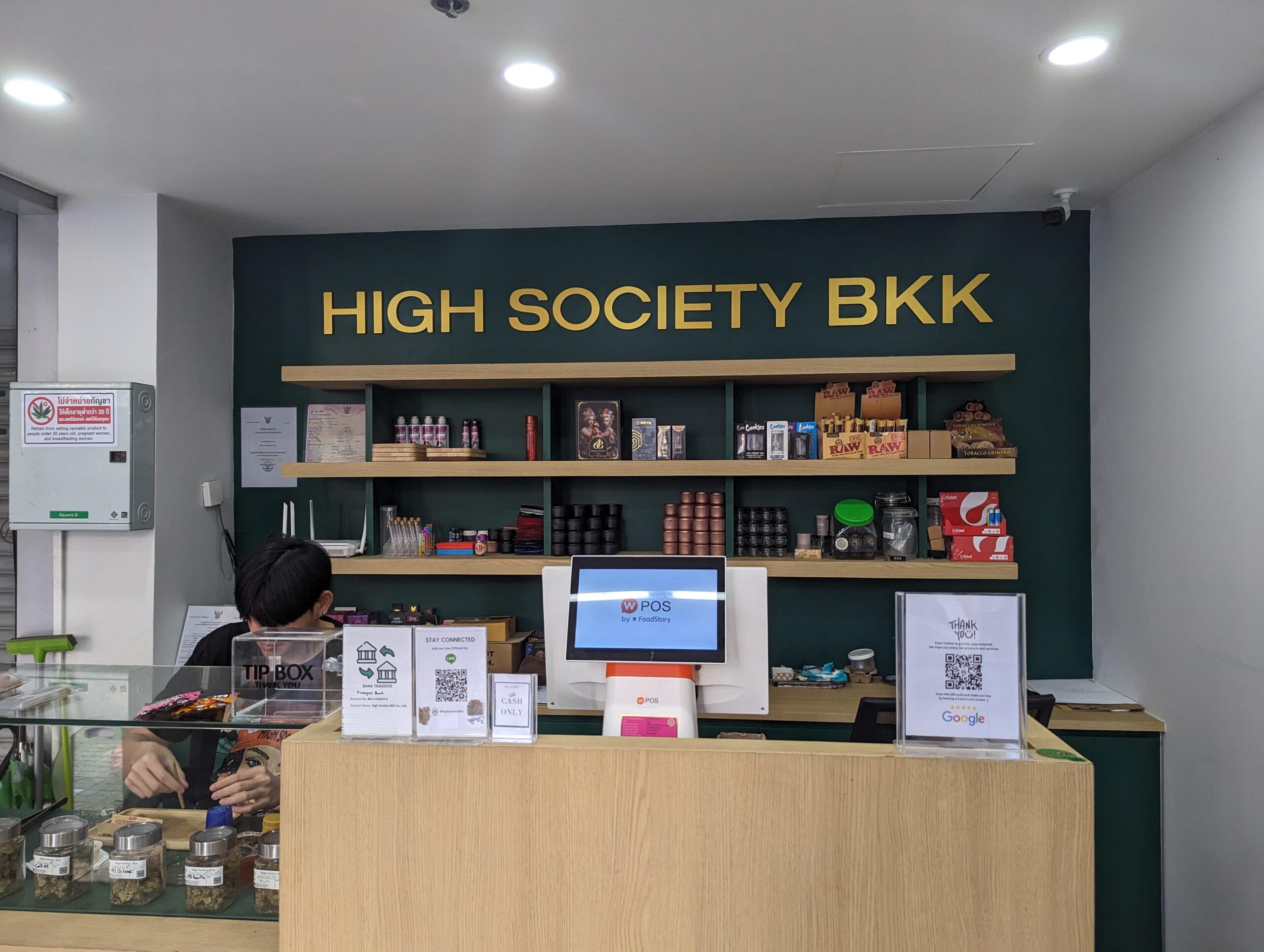 A weed store cashier desk called High Society BKK.